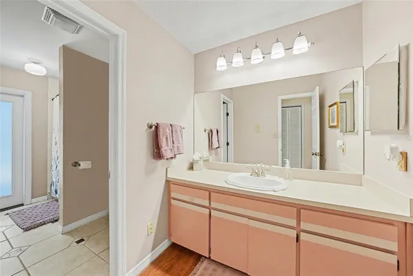 a bathroom with a sink double vanity and a mirror