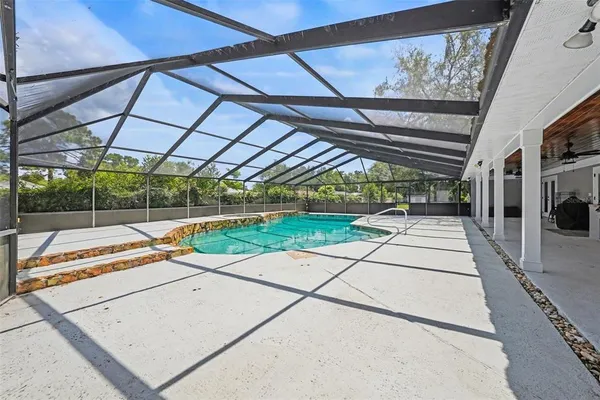 a view of a backyard with sitting area