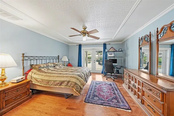 a bed room with a bed and a chair