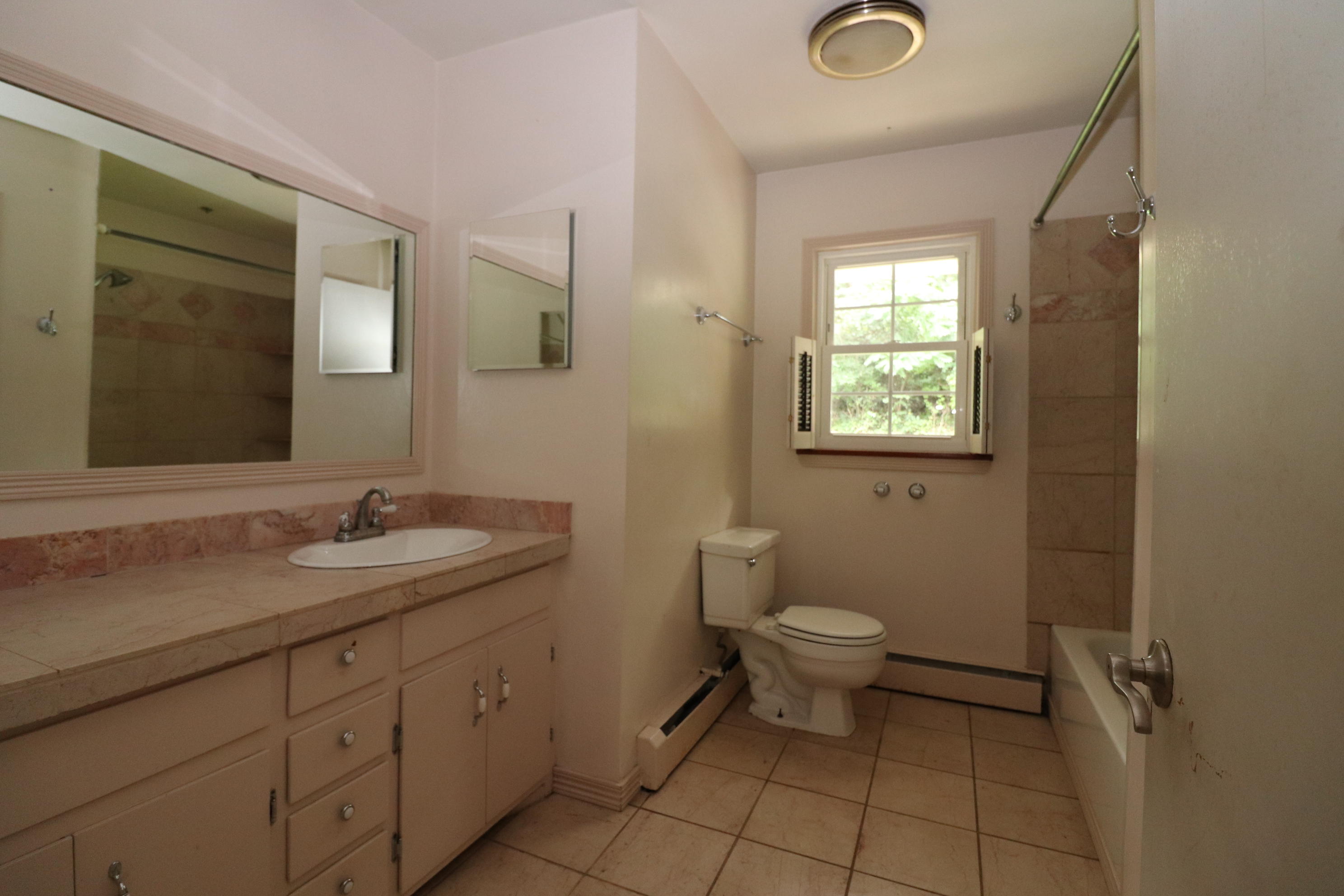 5501 Lafayette Road Elliston, VA 24087 - Photo 14 of 18 a bathroom with a toilet sink and mirror