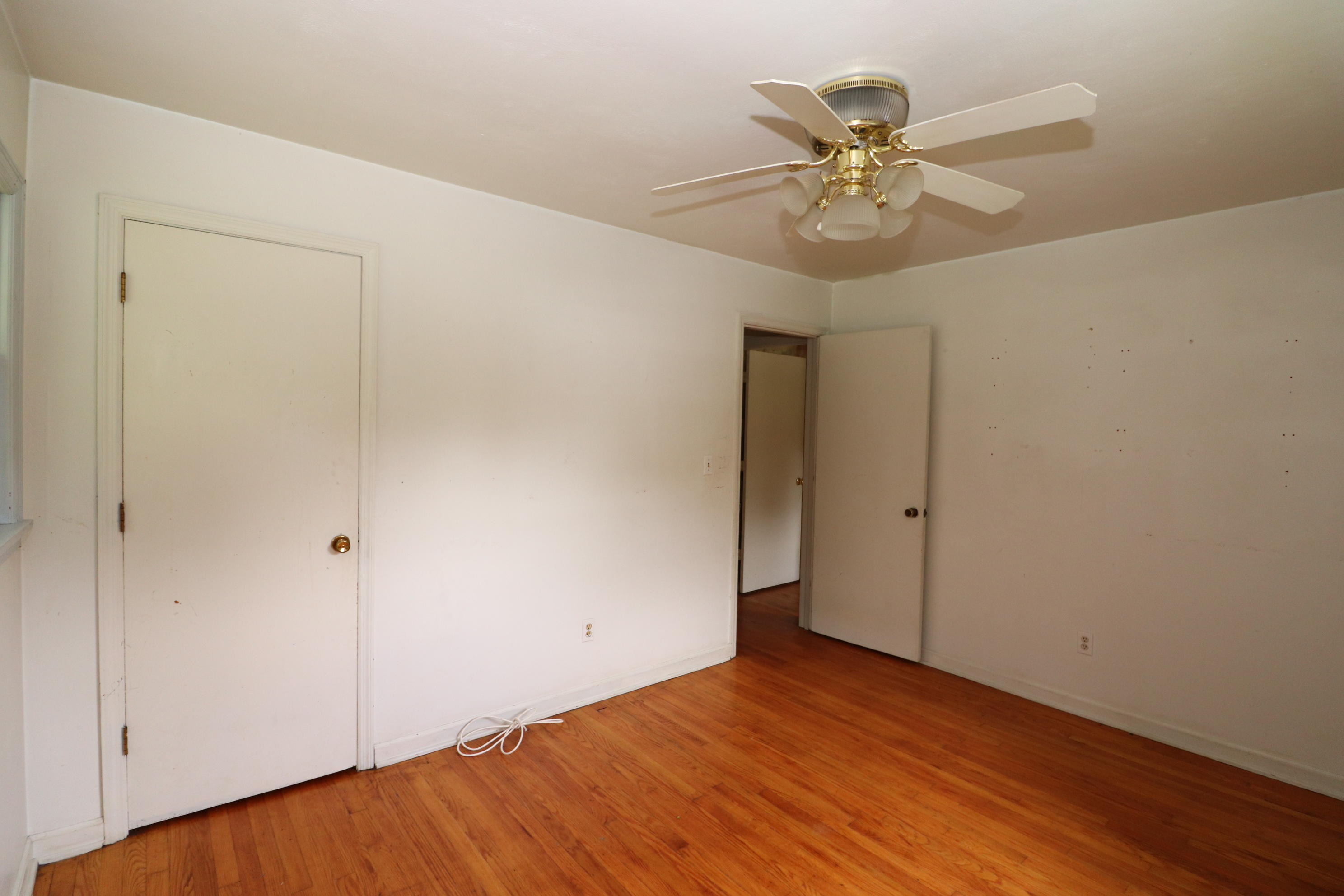 5501 Lafayette Road Elliston, VA 24087 - Photo 17 of 18 a view of an empty room with a ceiling fan