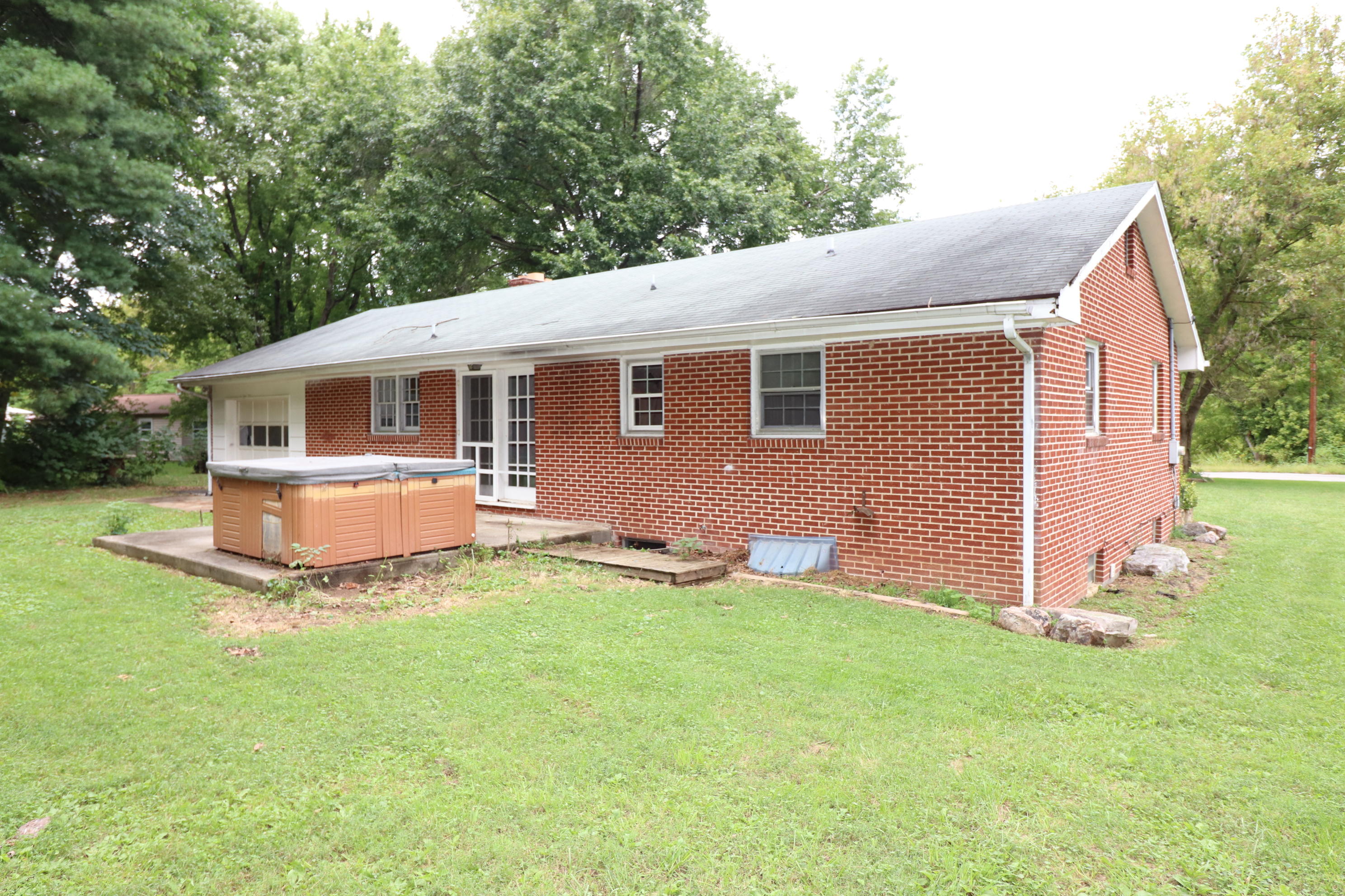 5501 Lafayette Road Elliston, VA 24087 - Photo 4 of 18 a front view of house with yard and trees in the background