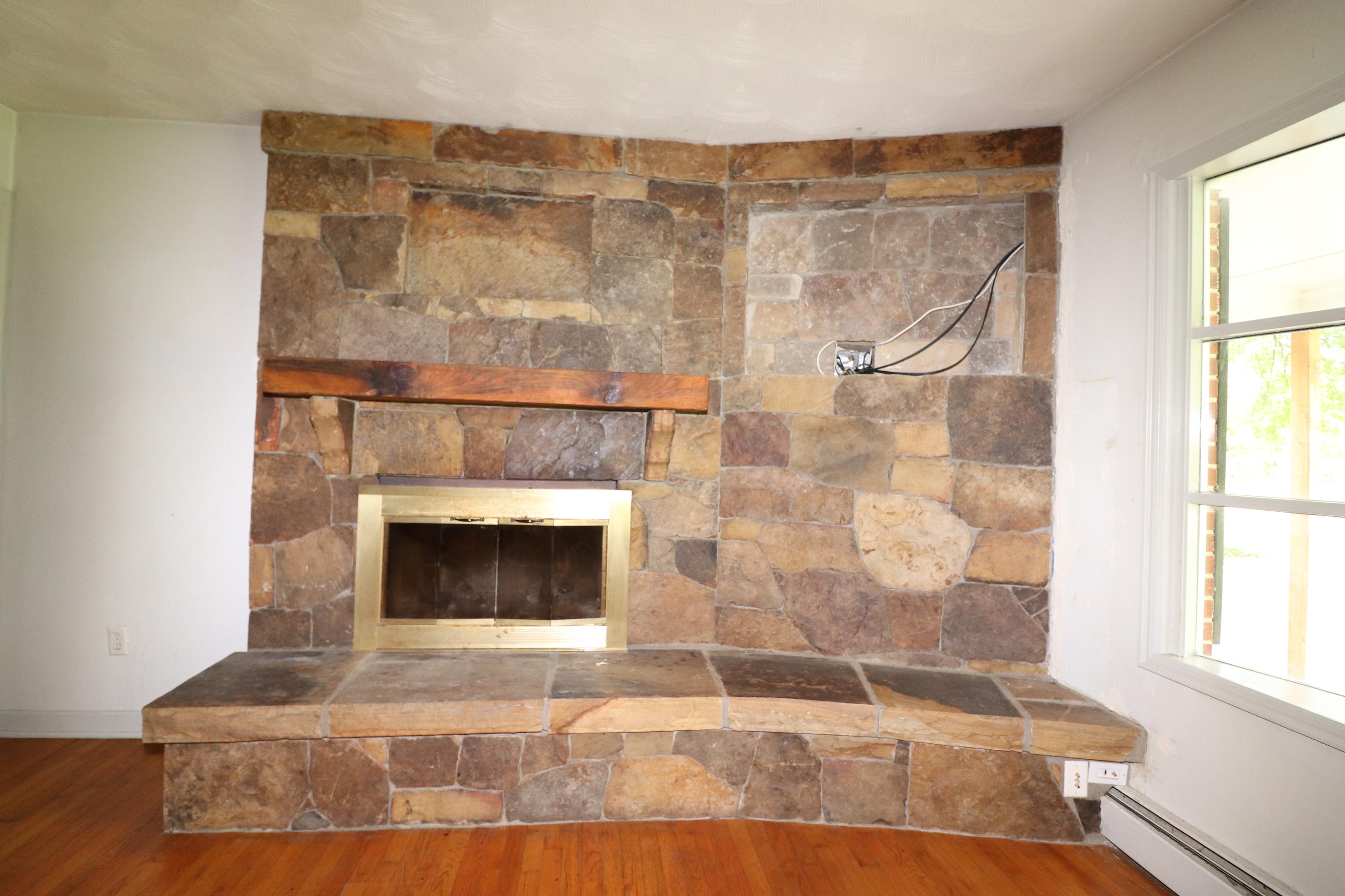 5501 Lafayette Road Elliston, VA 24087 - Photo 8 of 18 a living room with a fireplace