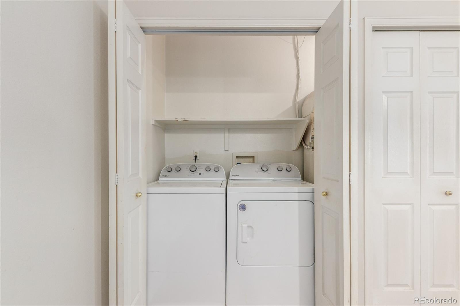 12931 Lafayette Street, Unit G Thornton, CO 80241 - Photo 17 of 21 a utility room with dryer and washer