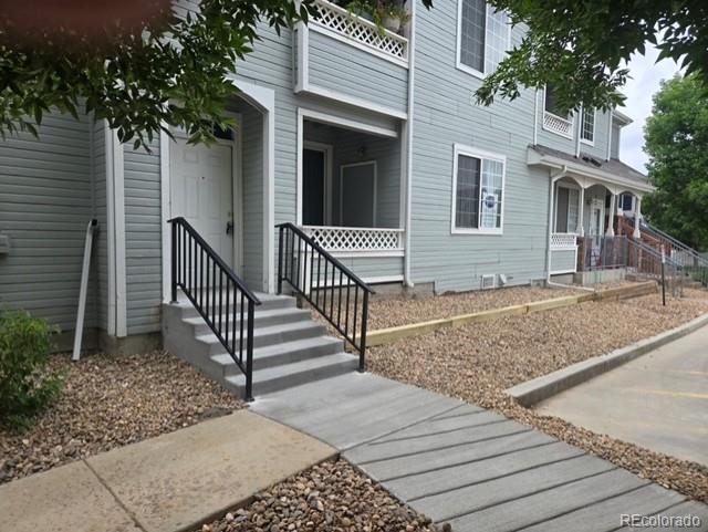12931 Lafayette Street, Unit G Thornton, CO 80241 - Photo 21 of 21 a view of a house with a porch
