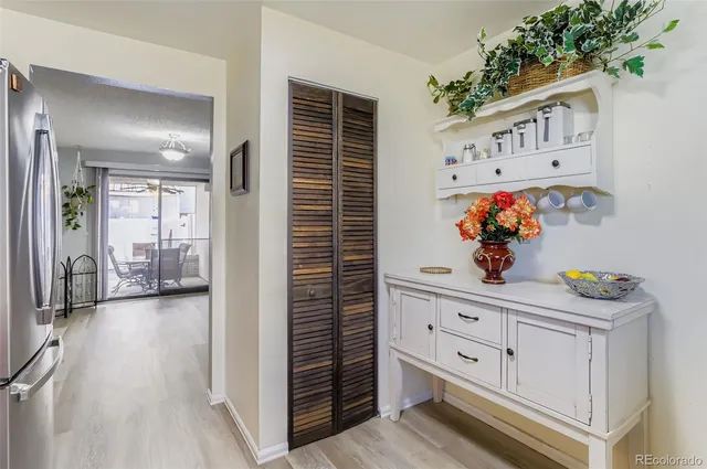 a view of hallway with wooden floor