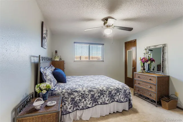 a bedroom with a bed and dresser