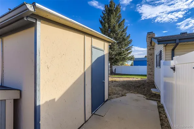 a view of a street with a car park in front of it