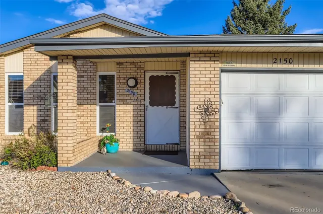 a front view of a house with a garage