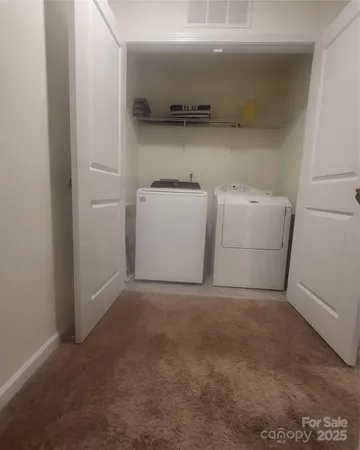 a view of a storage & utility room with a sink