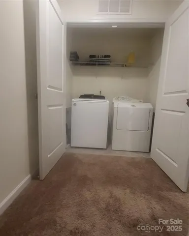 a view of a storage & utility room with a sink
