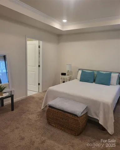 a bedroom with a bed and chair