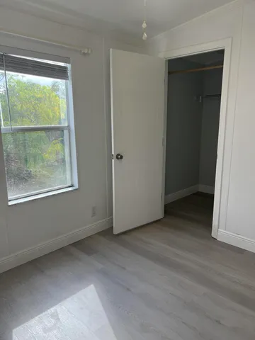 a view of an empty room with a window