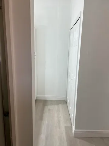 a spacious bathroom with a granite countertop sink a mirror and a