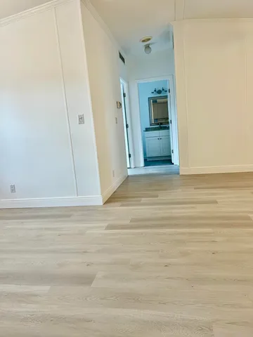 a view of room with window and hardwood floor