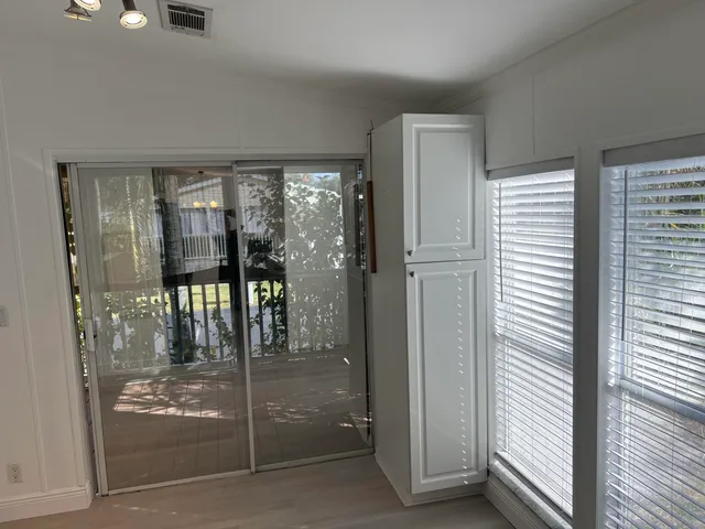 a bathroom with a glass shower door
