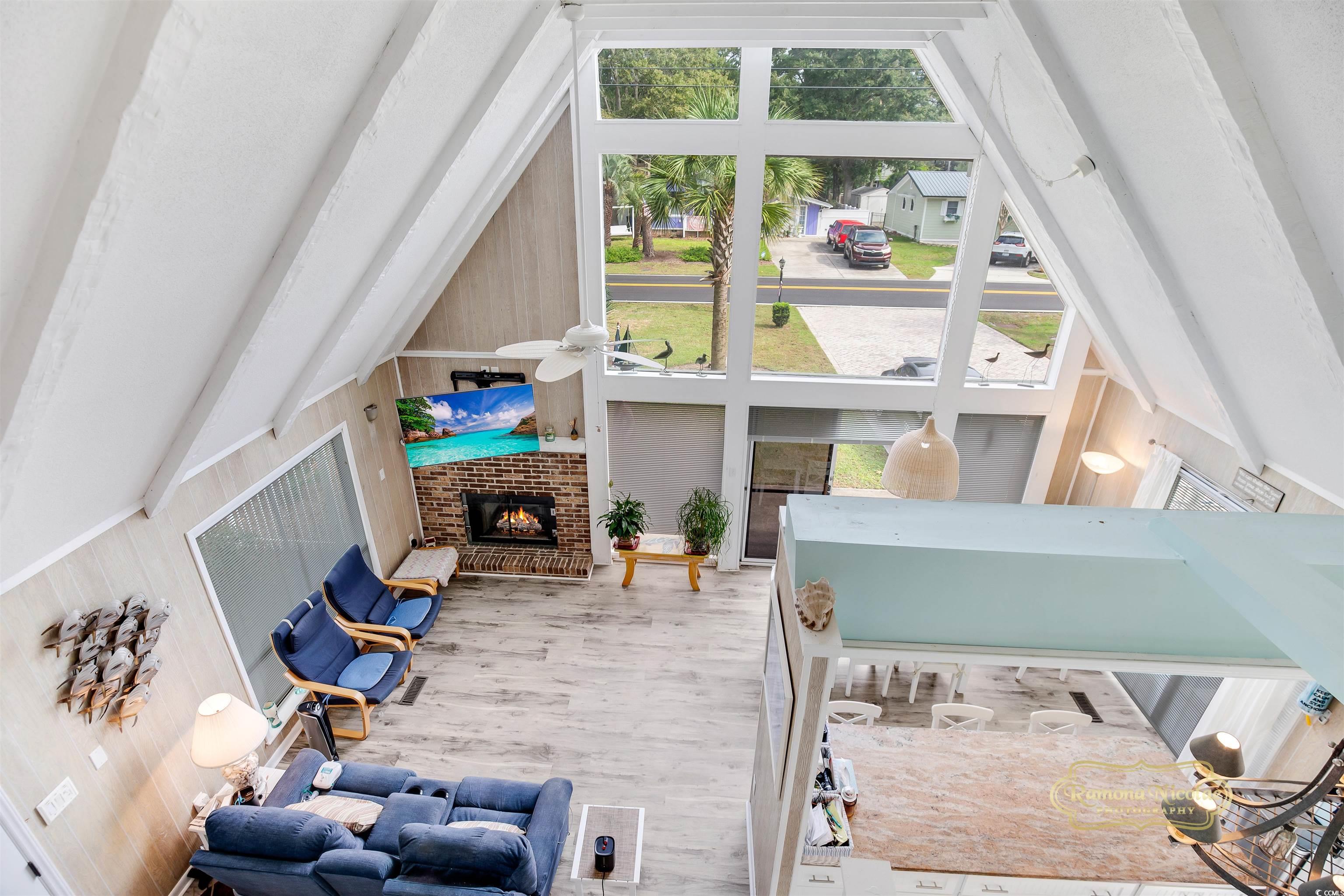 617 3rd Avenue South Surfside Beach, SC 29575 - Photo 14 of 36 Living room with hardwood / wood-style flooring, w