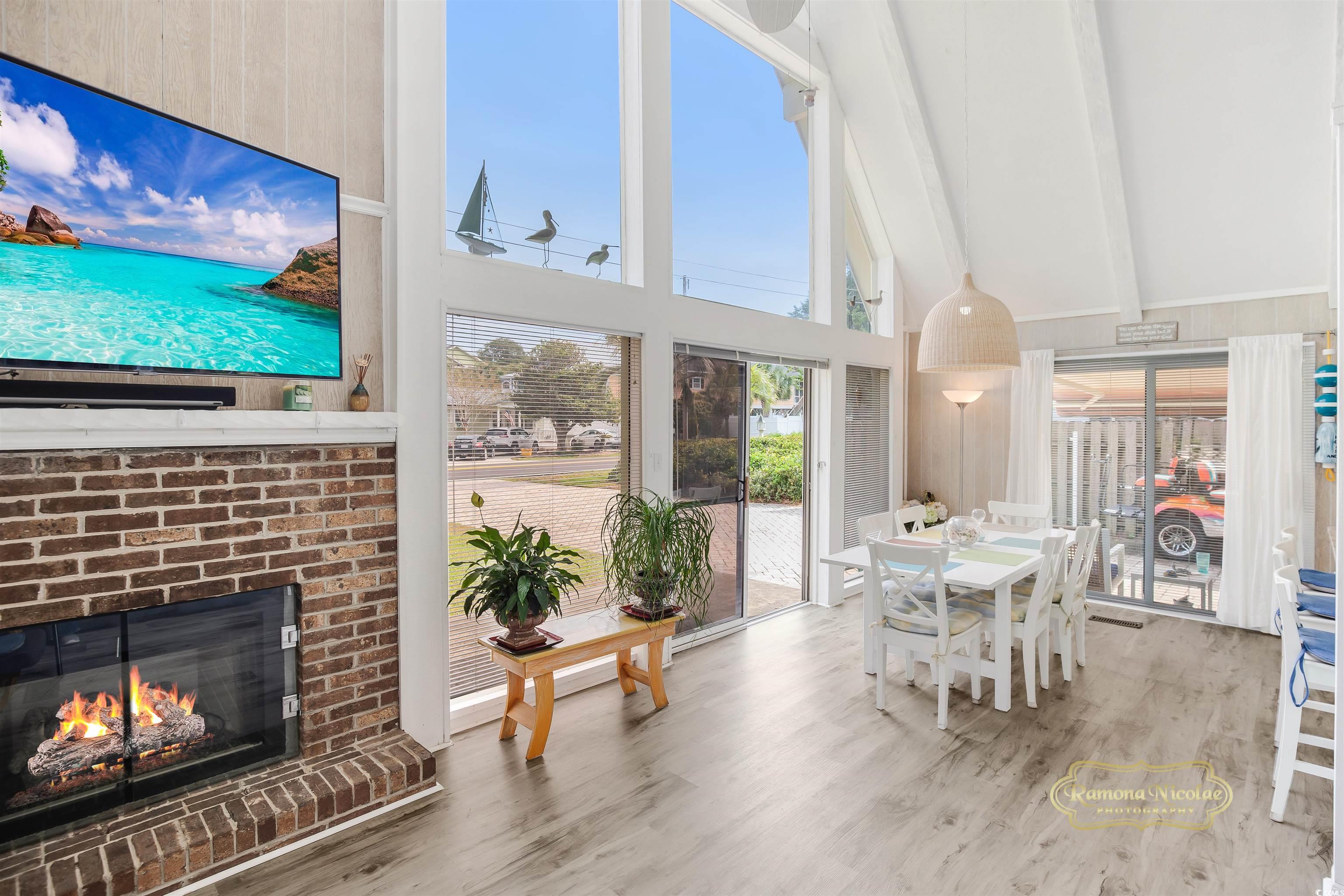 617 3rd Avenue South Surfside Beach, SC 29575 - Photo 15 of 36 featuring vaulted ceiling with beams and a firepla