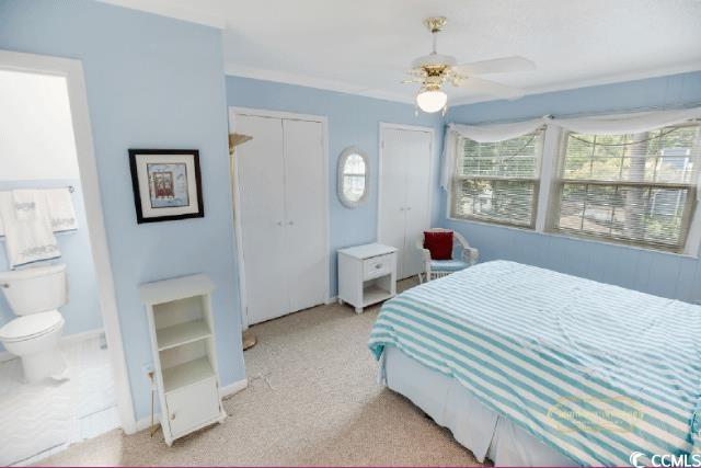 617 3rd Avenue South Surfside Beach, SC 29575 - Photo 23 of 36 Carpeted bedroom with ceiling fan and ensuite bath