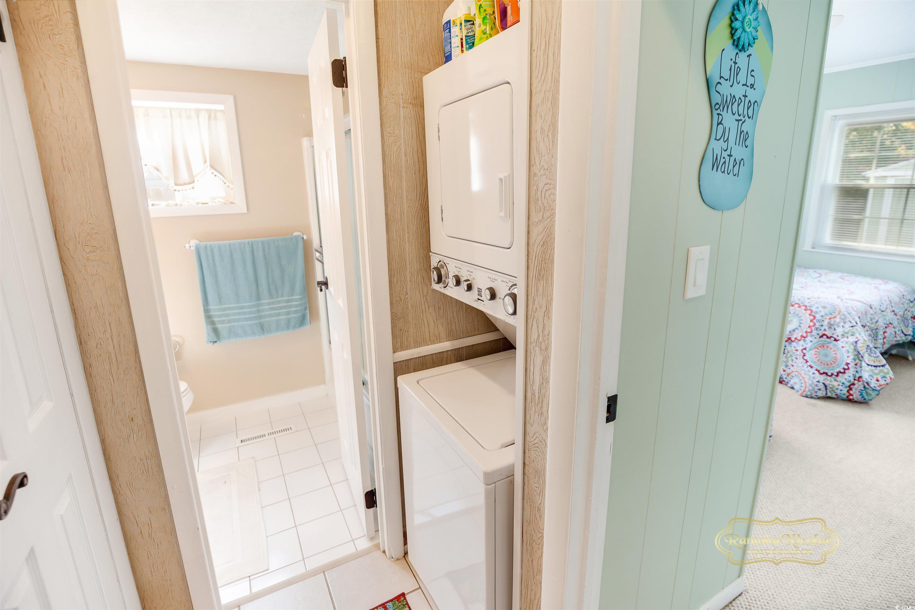 617 3rd Avenue South Surfside Beach, SC 29575 - Photo 25 of 36 Clothes washing area with stacked washing maching