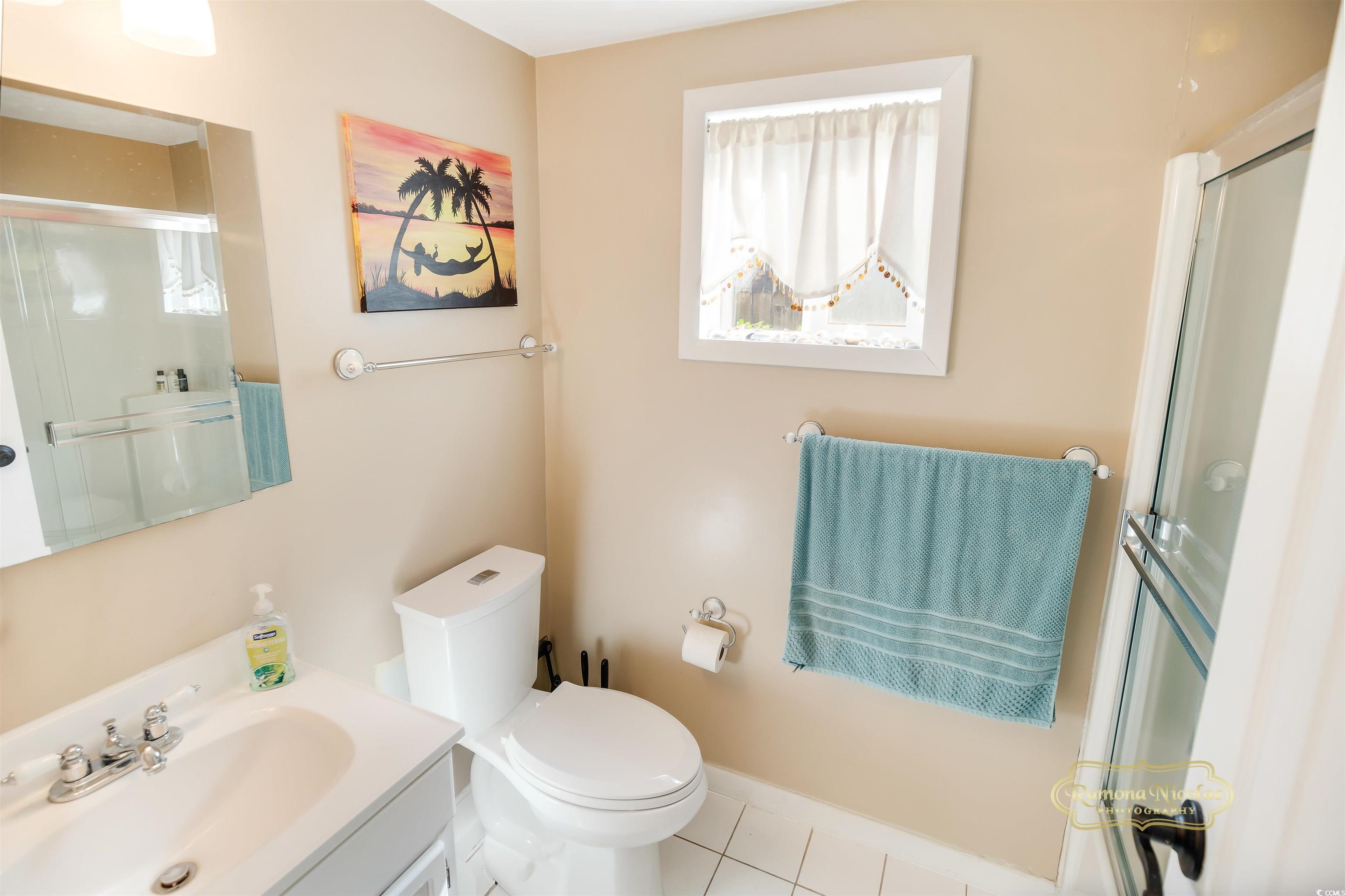 617 3rd Avenue South Surfside Beach, SC 29575 - Photo 27 of 36 Bathroom with tile patterned flooring, vanity, wal