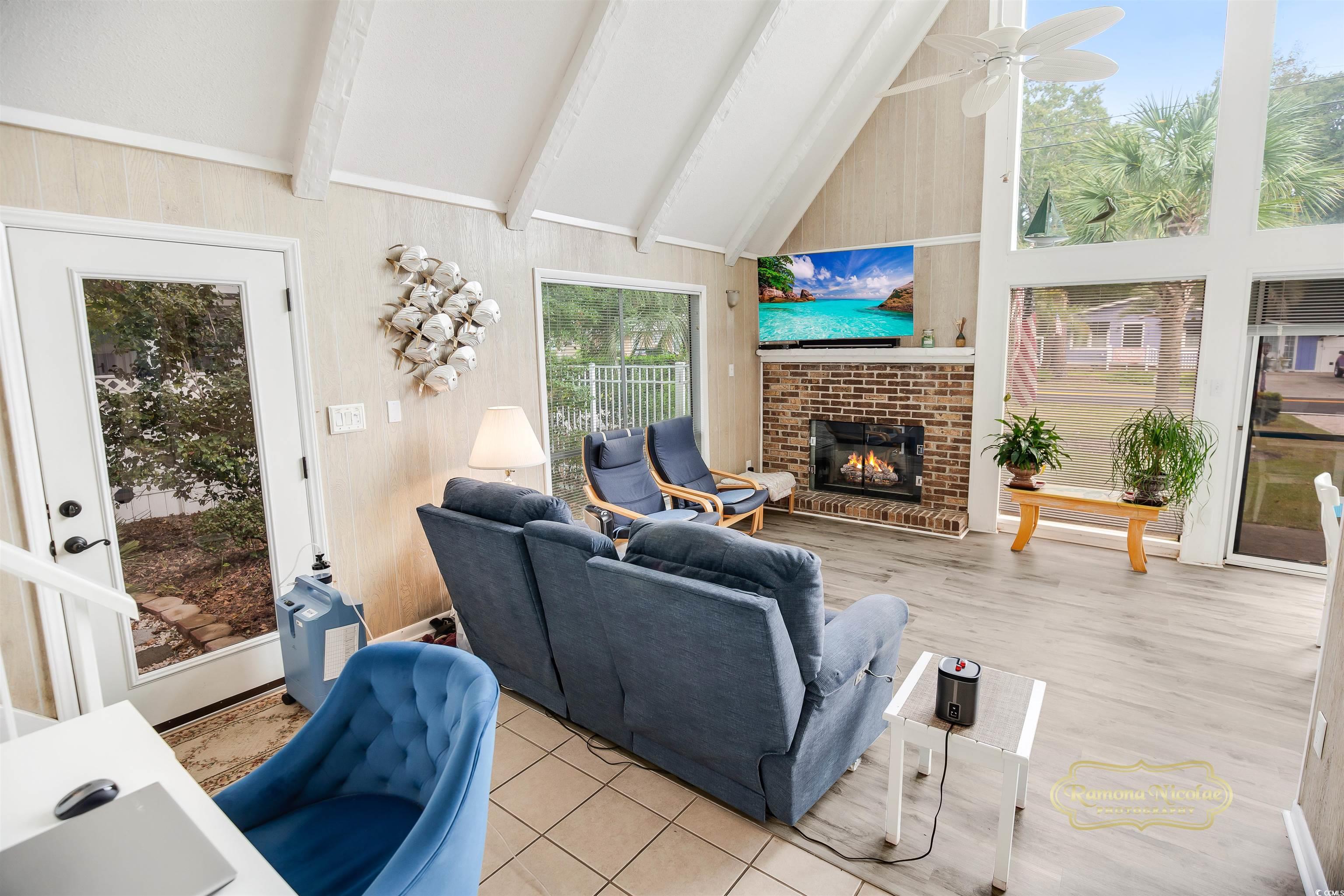 617 3rd Avenue South Surfside Beach, SC 29575 - Photo 6 of 36 Living room featuring ceiling fan, beam ceiling, a