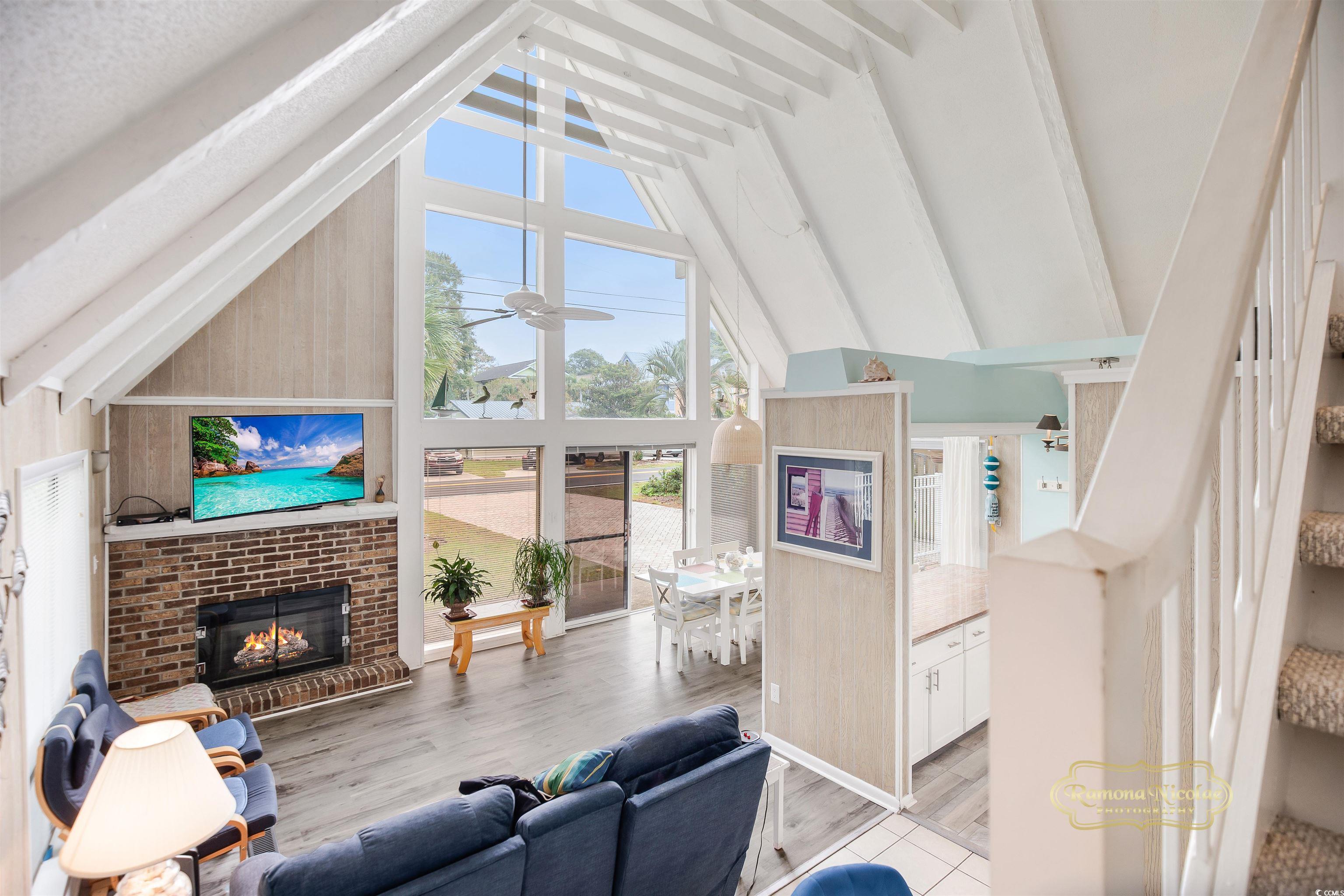 617 3rd Avenue South Surfside Beach, SC 29575 - Photo 9 of 36 Living room with a brick fireplace, high vaulted c