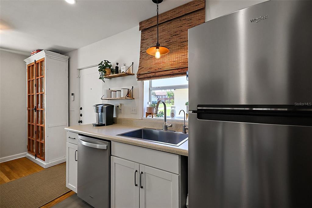 30 East Key Avenue Eustis, FL 32726 - Photo 12 of 32 a kitchen with a refrigerator and a sink