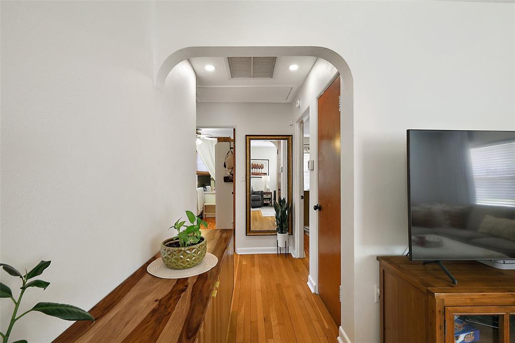 30 East Key Avenue Eustis, FL 32726 - Photo 15 of 32 a view of a hallway with wooden floor and staircase