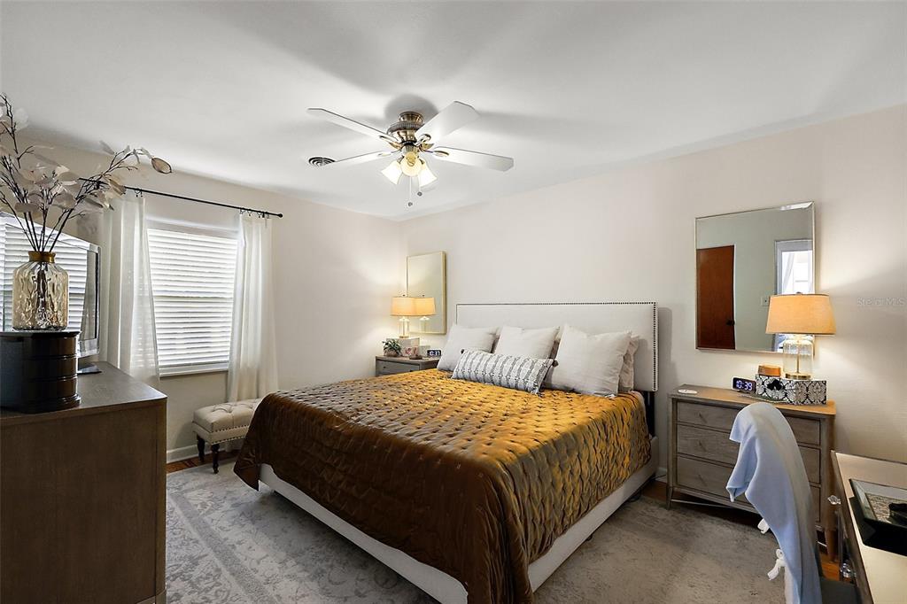 30 East Key Avenue Eustis, FL 32726 - Photo 17 of 32 a bedroom with a bed and a couch