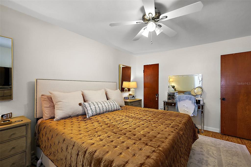 30 East Key Avenue Eustis, FL 32726 - Photo 18 of 32 a bedroom with a bed and a chandelier