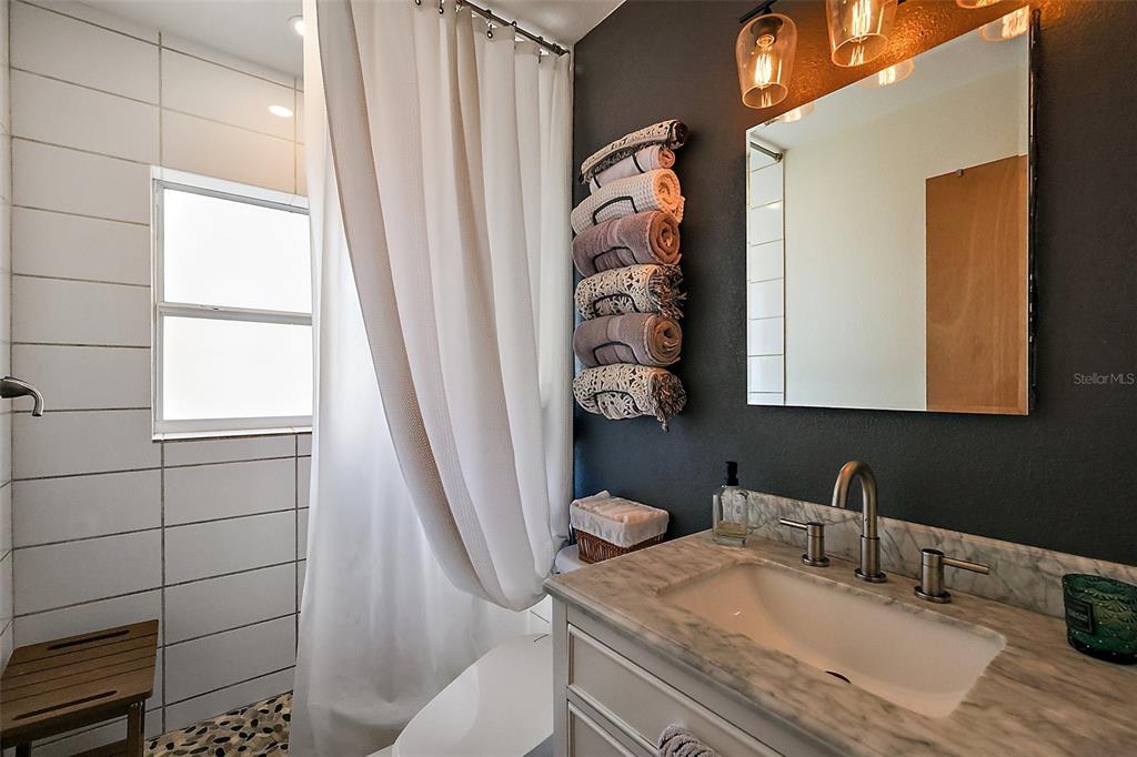 30 East Key Avenue Eustis, FL 32726 - Photo 20 of 32 a bathroom with a sink a toilet and a mirror