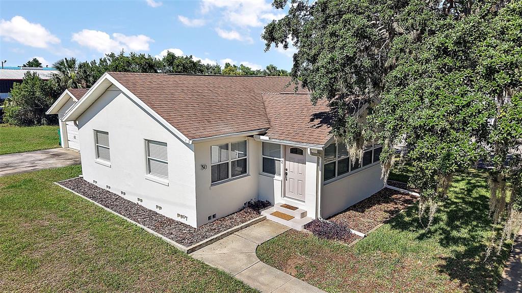 30 East Key Avenue Eustis, FL 32726 - Photo 2 of 32 a view of a house with a yard