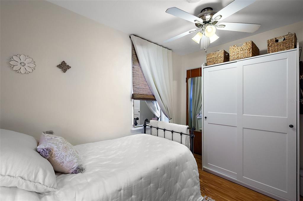 30 East Key Avenue Eustis, FL 32726 - Photo 22 of 32 a bedroom with a bed and a chandelier