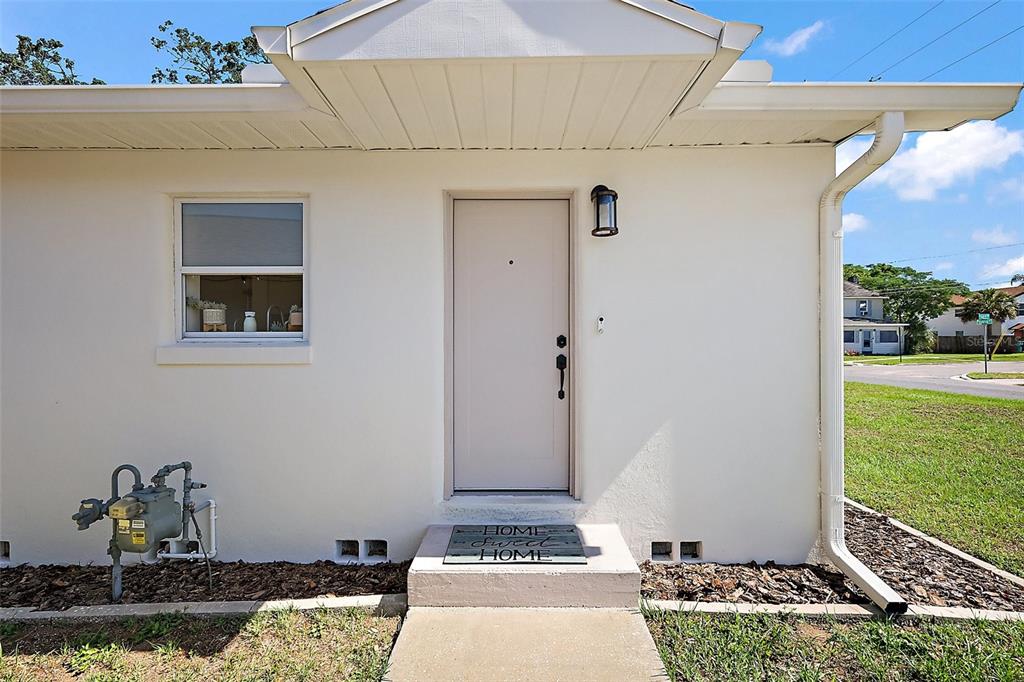 30 East Key Avenue Eustis, FL 32726 - Photo 26 of 32 a front view of a house with garden