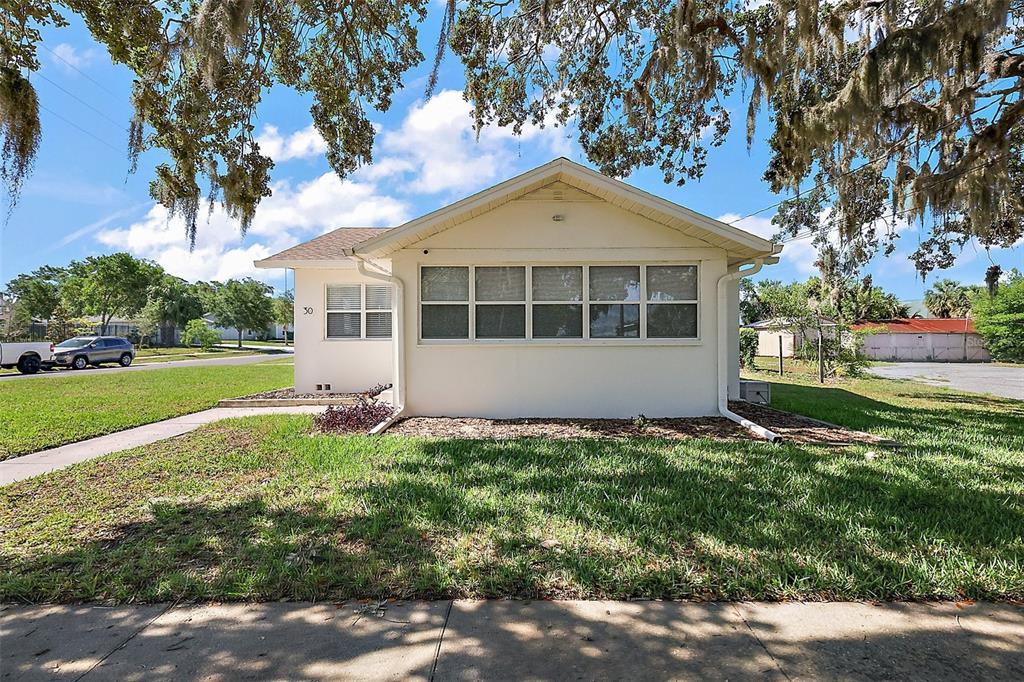 30 East Key Avenue Eustis, FL 32726 - Photo 32 of 32 a view of an house with backyard space and garden