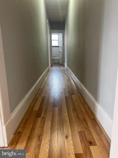 639 Plymouth Road, Unit A2 Baltimore, MD 21229 - Photo 6 of 14 a view of a hallway with wooden floor