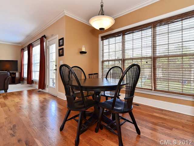 512 St Ives Court Fort Mill, SC 29708 - Photo 7 of 16 a view of a dining room with furniture window and wooden floor
