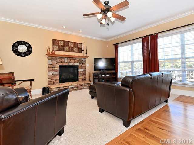 512 St Ives Court Fort Mill, SC 29708 - Photo 8 of 16 a living room with furniture and a fireplace