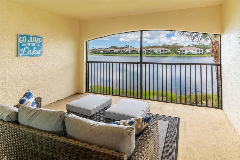 9521 Avellino Way, Unit 2426 Naples, FL 34113 - Photo 19 of 46 a living room with furniture and a window