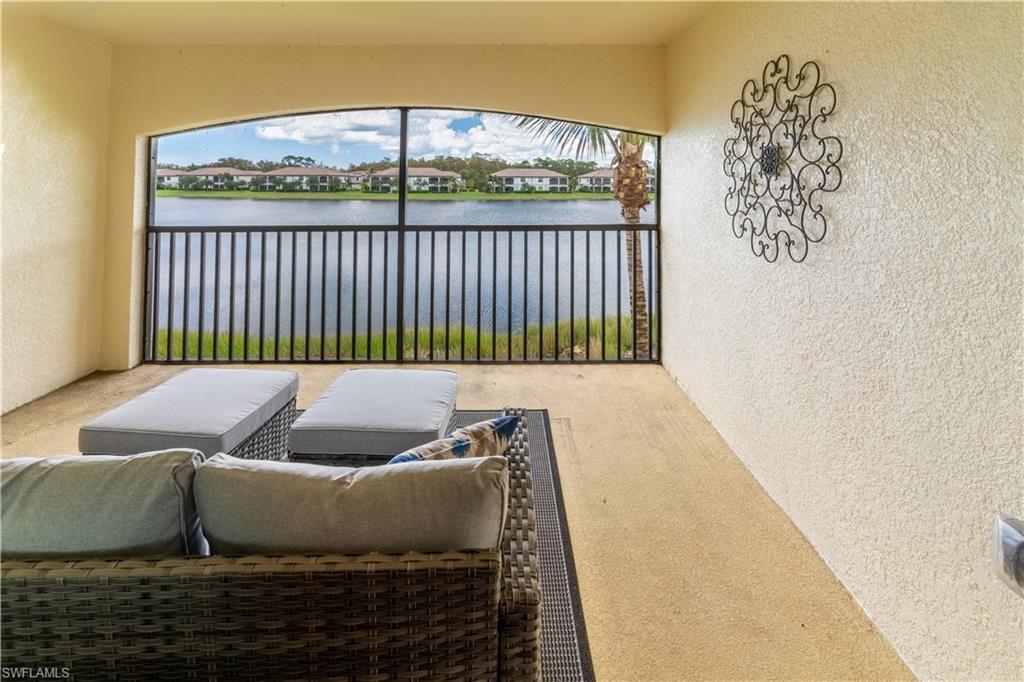 9521 Avellino Way, Unit 2426 Naples, FL 34113 - Photo 2 of 46 a bedroom with a bed and a window