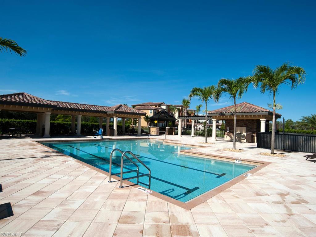 9521 Avellino Way, Unit 2426 Naples, FL 34113 - Photo 26 of 46 a view of a swimming pool with a patio