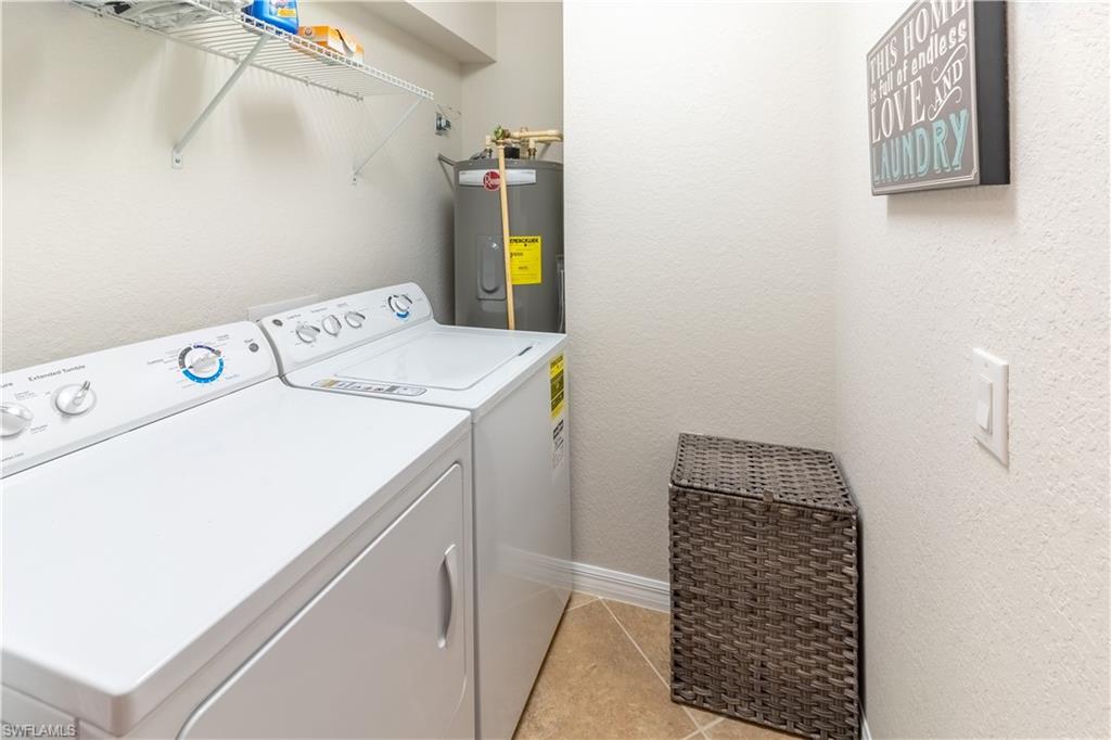 9521 Avellino Way, Unit 2426 Naples, FL 34113 - Photo 10 of 46 a utility room with dryer and washer