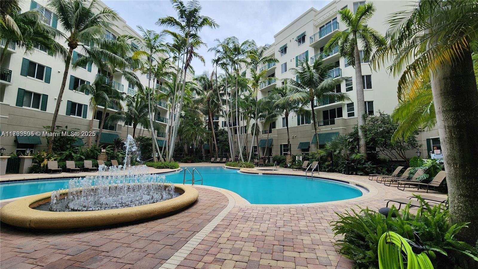 510 Northwest 84th Avenue, Unit 121 Plantation, FL 33324 - Photo 28 of 39 a view of a swimming pool with a patio
