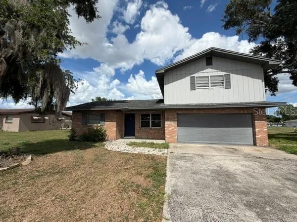 a house with yard in front of it