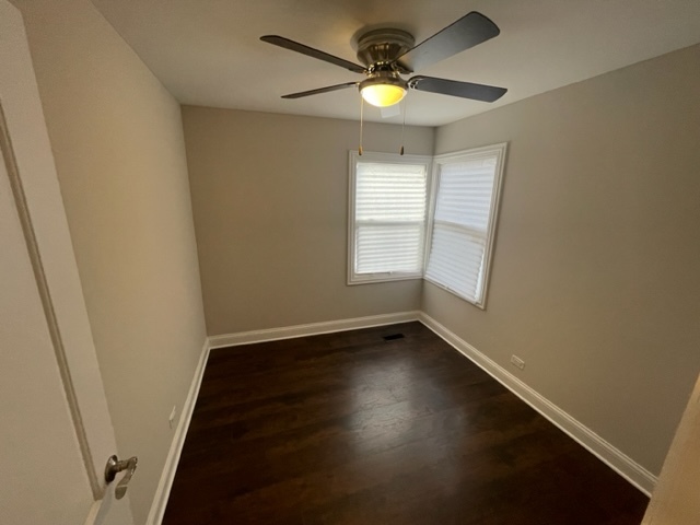 2814 Lexington Drive Hazel Crest, IL 60429 - Photo 8 of 10 an empty room with wooden floor and window
