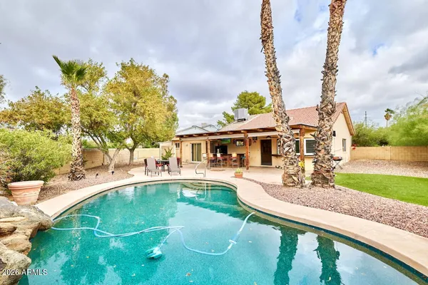 a view of a swimming pool with a patio