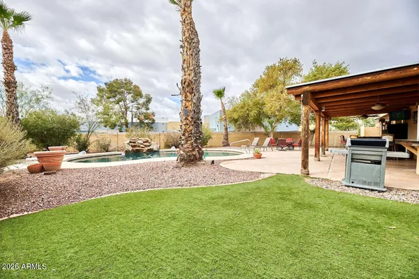 a view of a backyard with sitting area