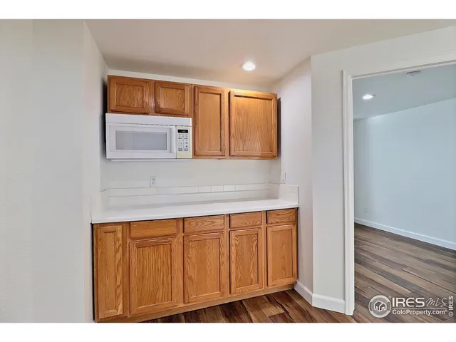 a view of kitchen with wooden floor