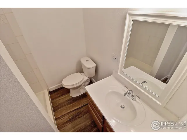 a bathroom with a sink toilet and vanity